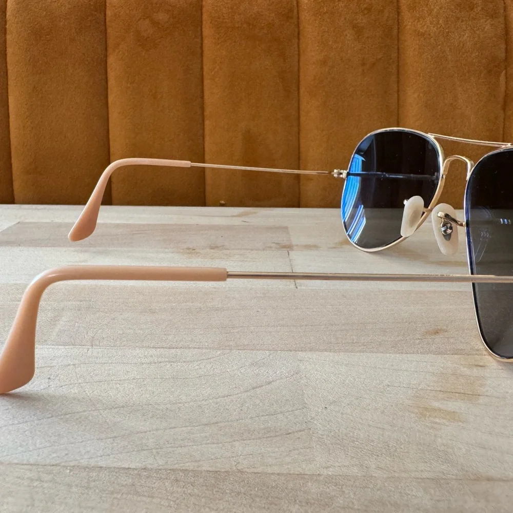 Ray-Ban Gold Frame Sunglasses with polarized Blue Lenses.